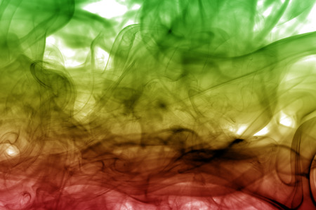 Smoke background reggae colors green, yellow, red colored in flag of reggae musicの写真素材