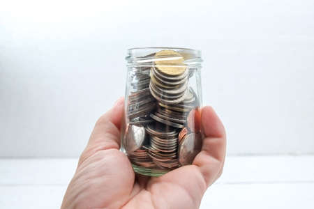 save money for investment concept Hands holding moneyの写真素材