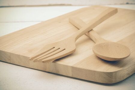 Wooden spoon on wood table with filter effect retro vintage styleの写真素材