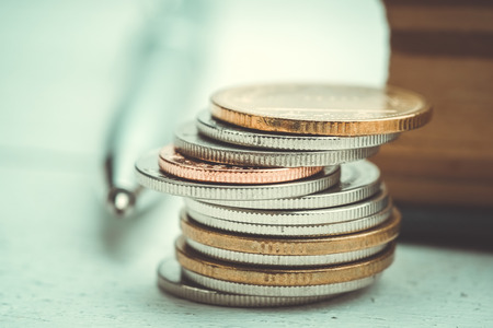 business finance. save money for investment concept coins with filter effect retro vintage styleの写真素材