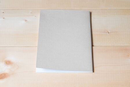 recycle notebook on wood background