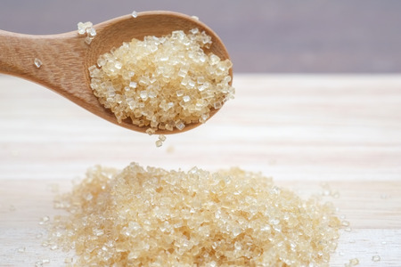 brown sugar heap on wooden table