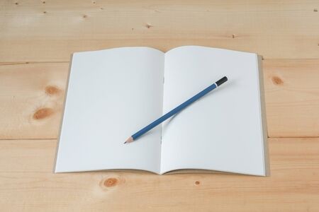 recycle notebook on wood background