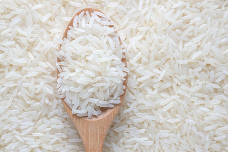 Jasmine rice and wooden spoonの写真素材
