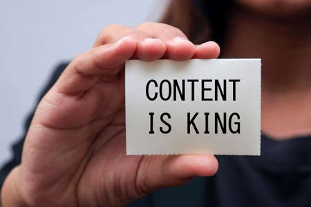 message on the card shown by a business womanの写真素材