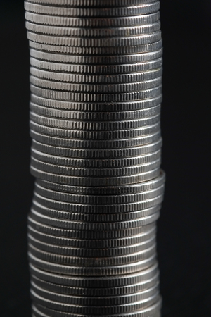 business finance. save money for investment concept coins on black backgroundの写真素材