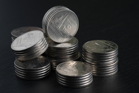 business finance. save money for investment concept coins on black backgroundの写真素材