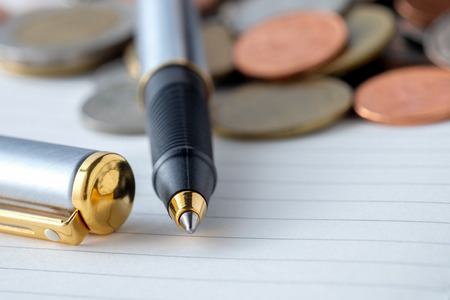 business finance. save money for investment concept coins and penの写真素材
