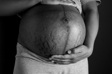 Belly of a pregnant womanの写真素材