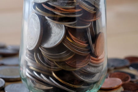 business finance. save money for investment concept money in the glassの写真素材