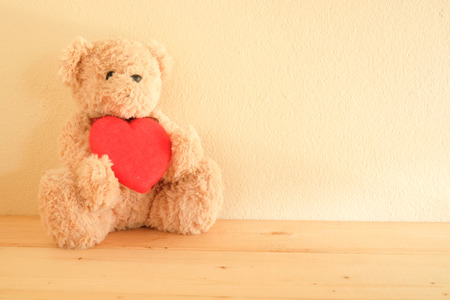 Teddy Bear toy alone on wooden table