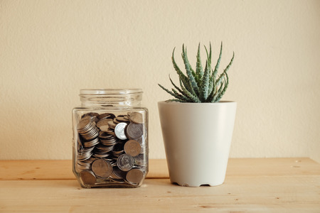 business finance. save money for investment concept money in the glass