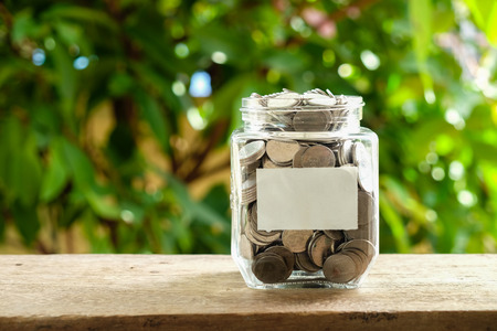business finance. save money for investment concept money in the glass