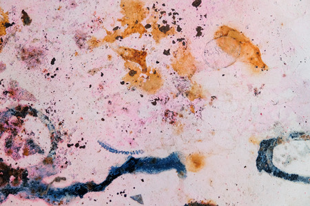 Weathered rusty metal texture close-up. Grungy iron surface with old speckled paint.