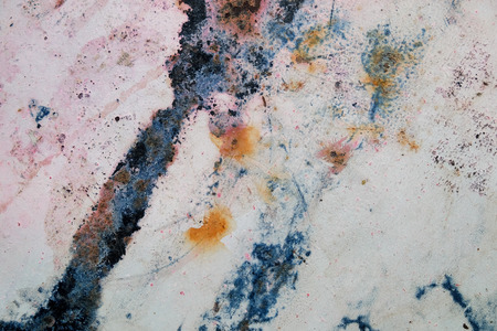 Weathered rusty metal texture close-up. Grungy iron surface with old speckled paint.