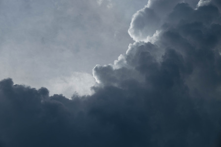 rain cloud dark motion at sunset light backgroundの写真素材