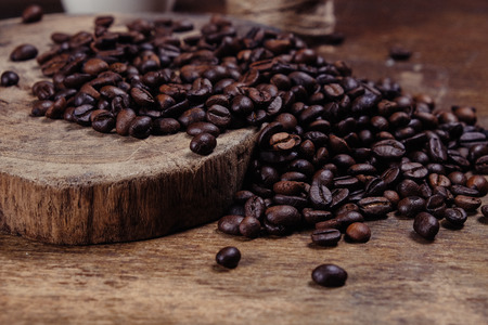 Coffee Bean on wood background with filter effect retro vintage styleの写真素材
