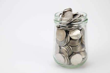 business finance. save money for investment concept money in the glass