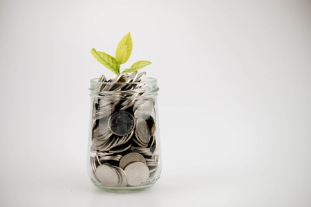 business finance. save money for investment concept money in the glassの写真素材