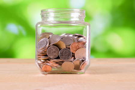 business finance. save money for investment concept money in the glass