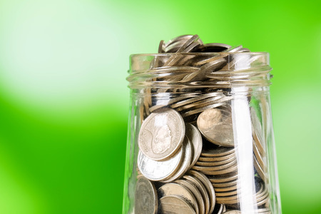 business finance. save money for investment concept money in the glass