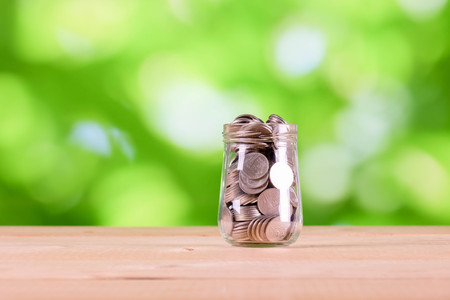 business finance. save money for investment concept money in the glass
