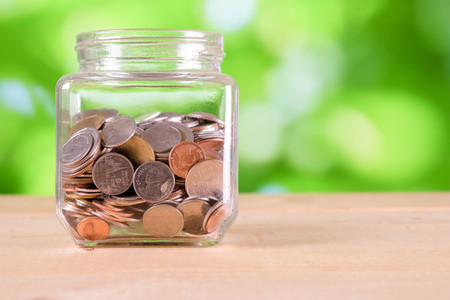 business finance. save money for investment concept money in the glass