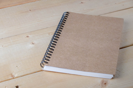 Recycled paper book on wooden backgroundの写真素材