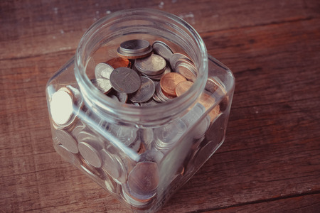 business finance. save money for investment concept money in the glass with filter effect retro...