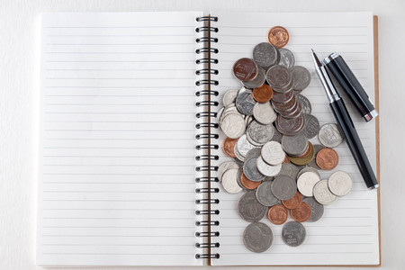 business finance. save money for investment concept coins and penの写真素材