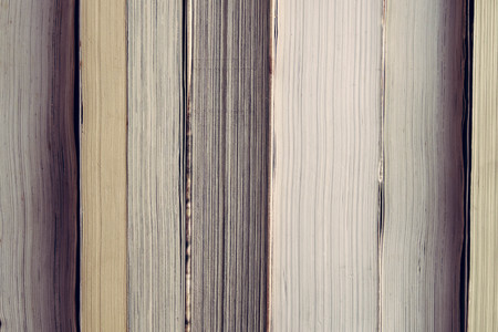 The book is on a wooden table with filter effect retro vintage styleの写真素材