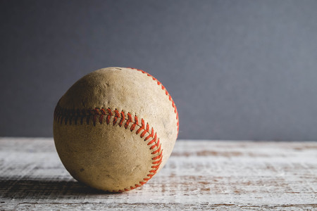 old Baseball and glove on wood background with filter effect retro vintage styleの写真素材
