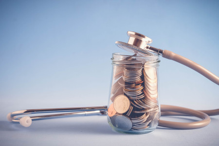 save money for investment concept Stethoscope and money  with filter effect retro vintage styleの写真素材