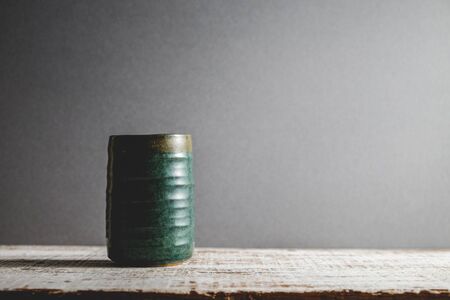 Ceramic cup molded from clay and burned with heat with filter effect retro vintage styleの写真素材