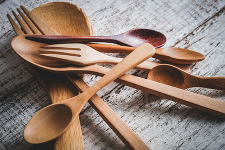 Wooden spoon on wood table with filter effect retro vintage styleの写真素材