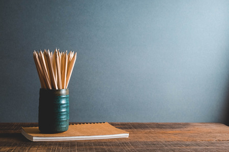 Concept of education pencil and book on table with filter effect retro vintage styleの写真素材
