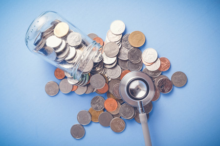 save money for investment concept Stethoscope and money  with filter effect retro vintage styleの写真素材