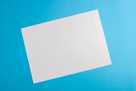 white torn paper with blue background, ready for designの写真素材