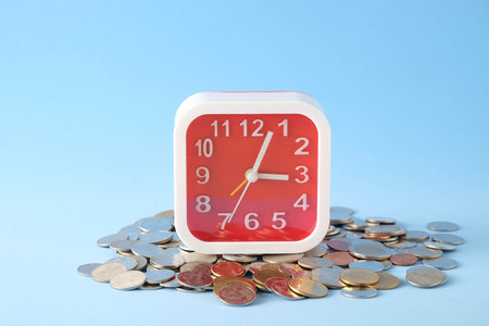 save money for investment concept Coin baht thai with alarm clocks
