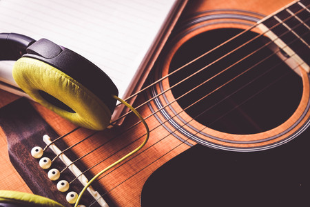 Close Up shot photo of Classic acoustic guitar with filter effect retro vintage style
