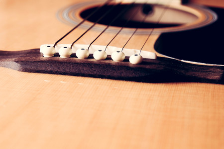Close Up shot photo of Classic acoustic guitar with filter effect retro vintage style