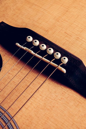 Close Up shot photo of Classic acoustic guitar with filter effect retro vintage style