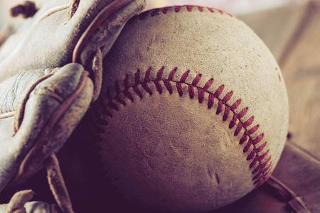 old Baseball on wood background with filter effect retro vintage styleの写真素材