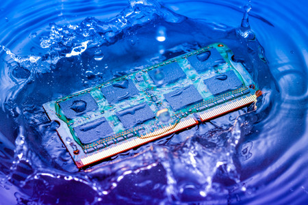 technology cyber electronic concept. cpu ram computer Fall into the water on blue light background. CPU cooling with waterの写真素材