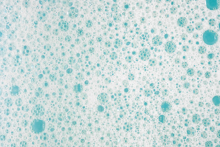 Abstract background white soapy foam texture. Shampoo foam with bubbles