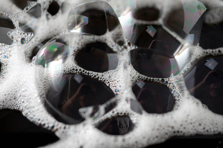 Abstract background white soapy foam texture. Shampoo foam with bubblesの写真素材