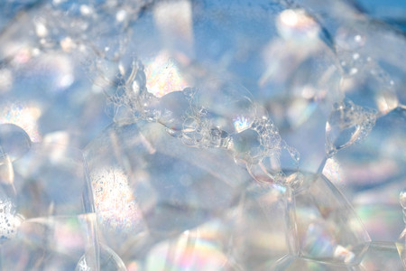 Abstract background white soapy foam texture. Shampoo foam with bubblesの写真素材