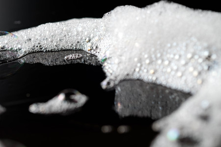 Abstract background white soapy foam texture. Shampoo foam with bubbles