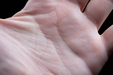 man hand holding isolated on black backgroundの写真素材