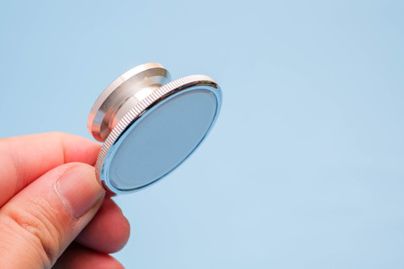 Stethoscope, medical instrument on blue backgroundの写真素材